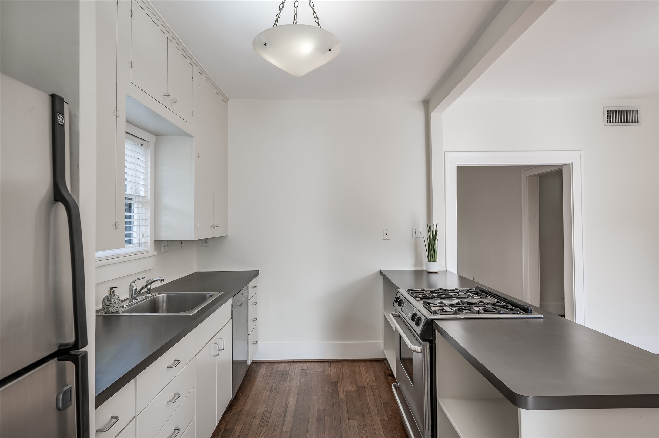 1737 Albans Road, Unit 1 Houston, TX 77005 - Photo 2 of 20 a kitchen with stainless steel appliances granite countertop a stove and a refrigerator