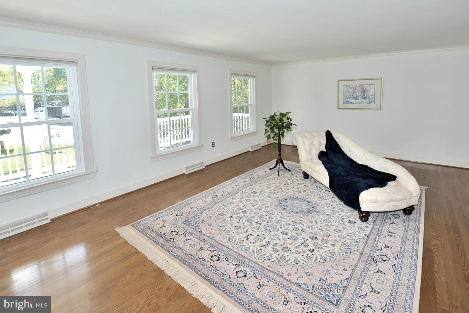 2805 Rifle Ridge Road Oakton, VA 22124 - Photo 7 of 30 a living room with furniture and a rug