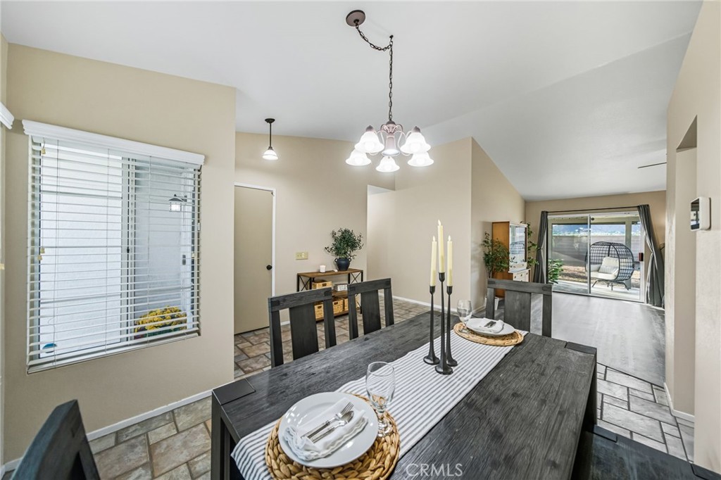 29787-29787 Berea Road Menifee, CA 92584 - Photo 15 of 45 a dining room with furniture a chandelier and wooden floor
