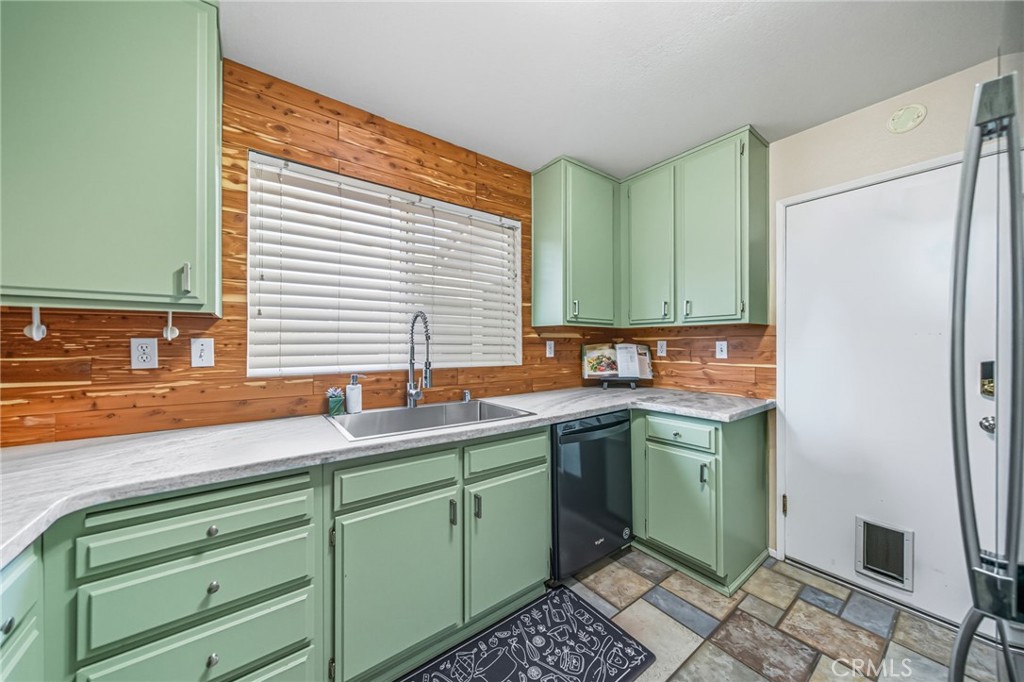 29787-29787 Berea Road Menifee, CA 92584 - Photo 19 of 45 a kitchen with a sink and a refrigerator