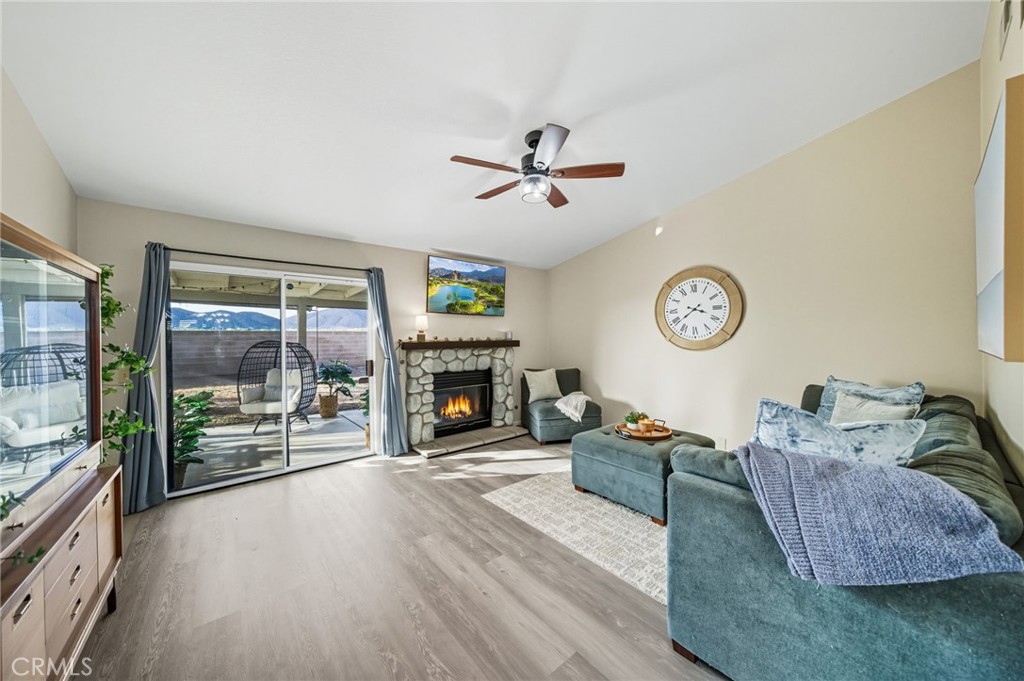 29787-29787 Berea Road Menifee, CA 92584 - Photo 23 of 45 a living room with furniture and a fireplace