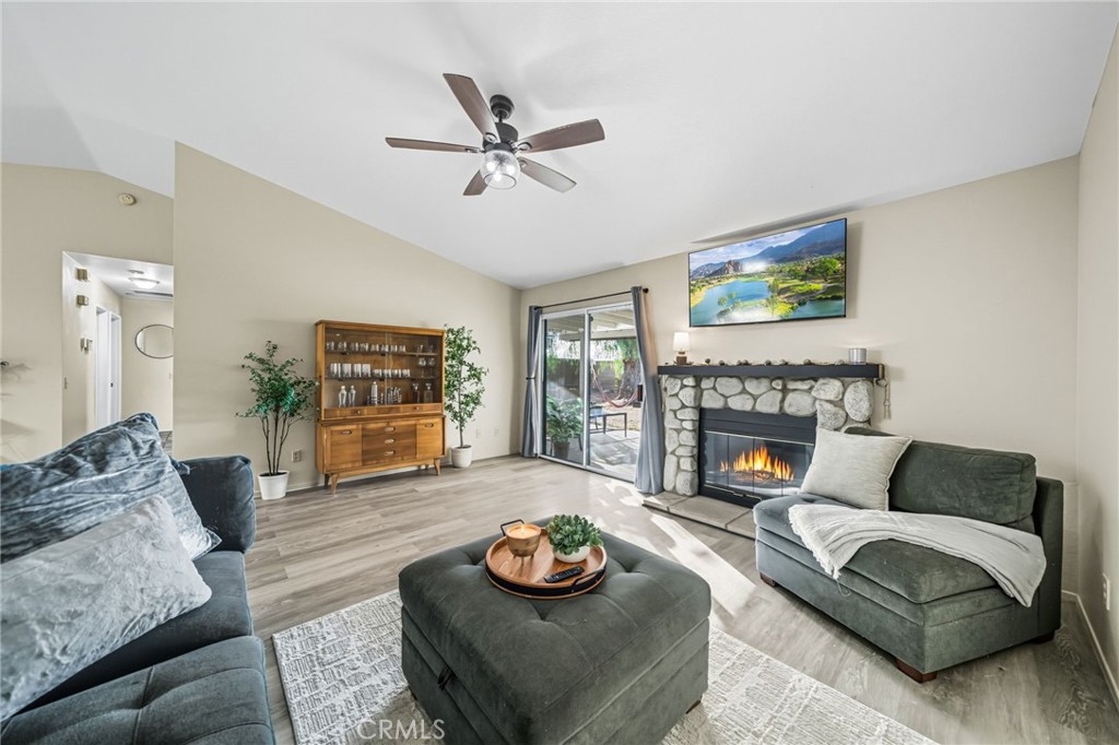 29787-29787 Berea Road Menifee, CA 92584 - Photo 26 of 45 a living room with furniture and a fireplace