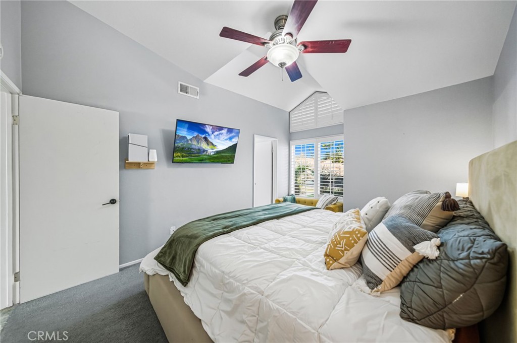 29787-29787 Berea Road Menifee, CA 92584 - Photo 29 of 45 a bed room with a bed and a chandelier