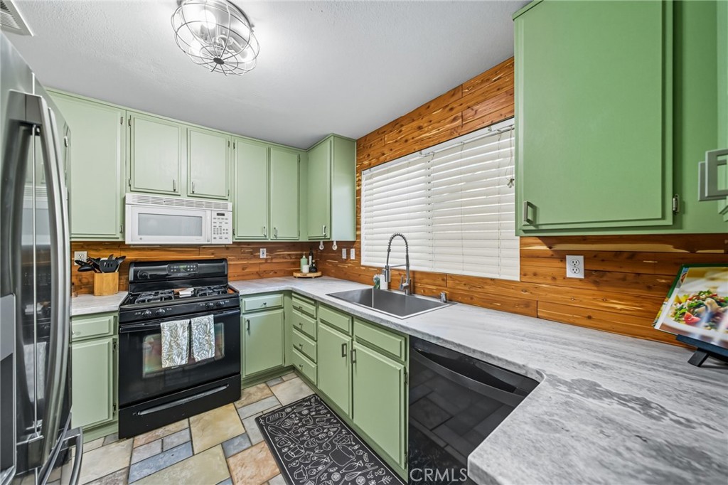29787-29787 Berea Road Menifee, CA 92584 - Photo 3 of 45 a kitchen with stainless steel appliances granite countertop a sink stove and refrigerator