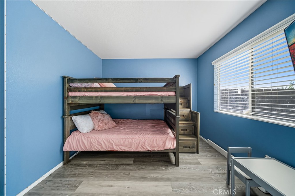 29787-29787 Berea Road Menifee, CA 92584 - Photo 34 of 45 a bedroom with a bed and window