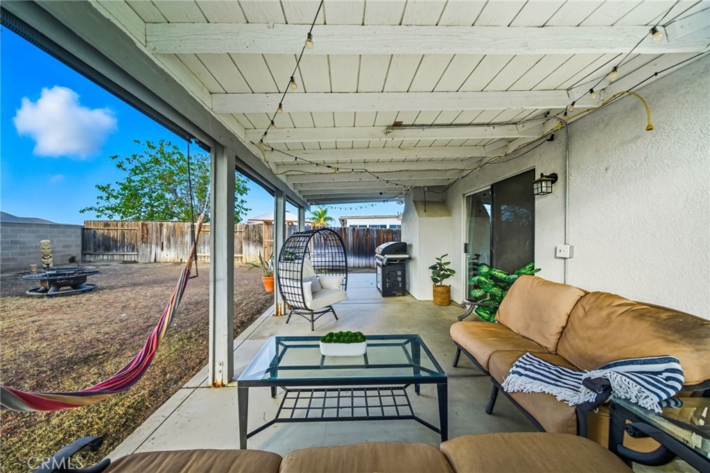 29787-29787 Berea Road Menifee, CA 92584 - Photo 40 of 45 a outdoor living space with furniture and a rug