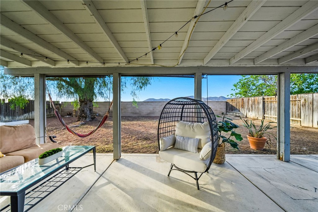29787-29787 Berea Road Menifee, CA 92584 - Photo 41 of 45 a view of a swimming pool with a couch and a swing chair