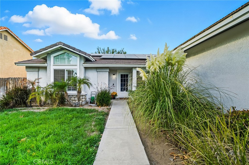 29787-29787 Berea Road Menifee, CA 92584 - Photo 9 of 45 a view of house with a yard and potted plants