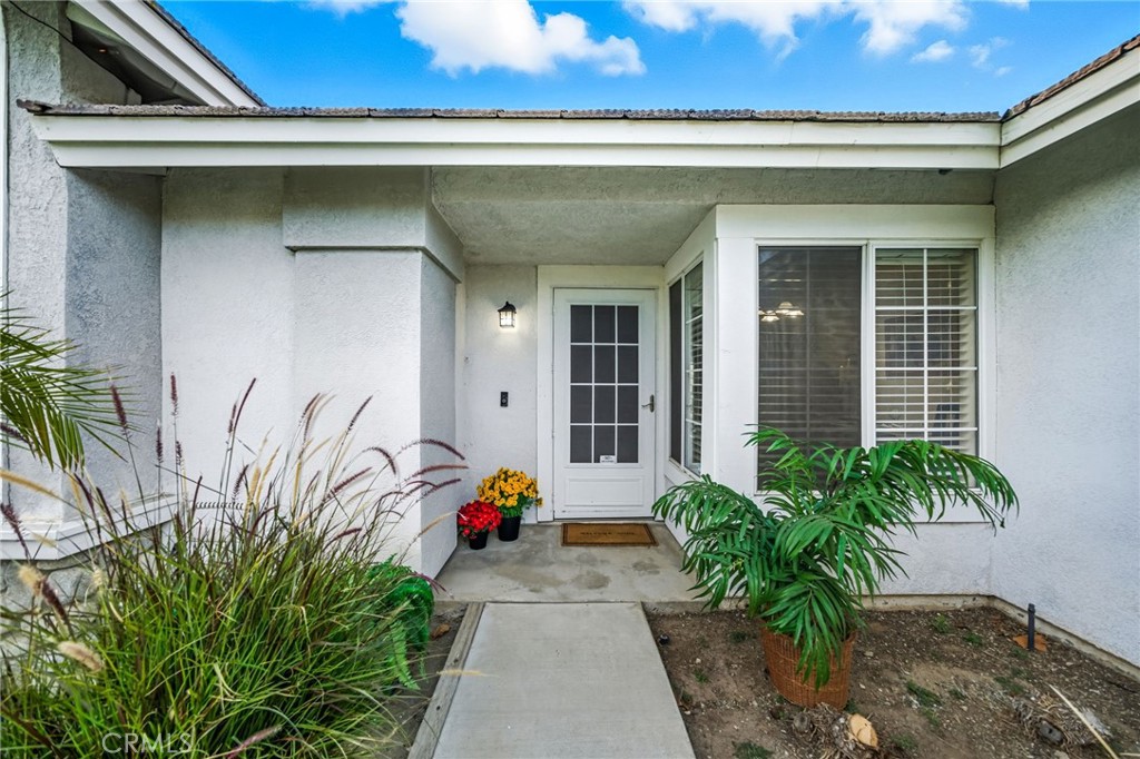 29787-29787 Berea Road Menifee, CA 92584 - Photo 10 of 45 a front view of a house with a garage