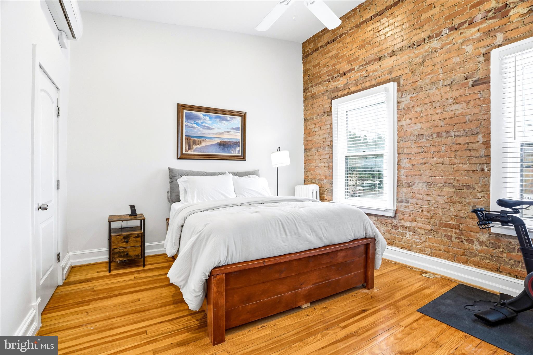 205 East 4th Street Frederick, MD 21701 - Photo 12 of 38 a bedroom with a bed and wooden floor