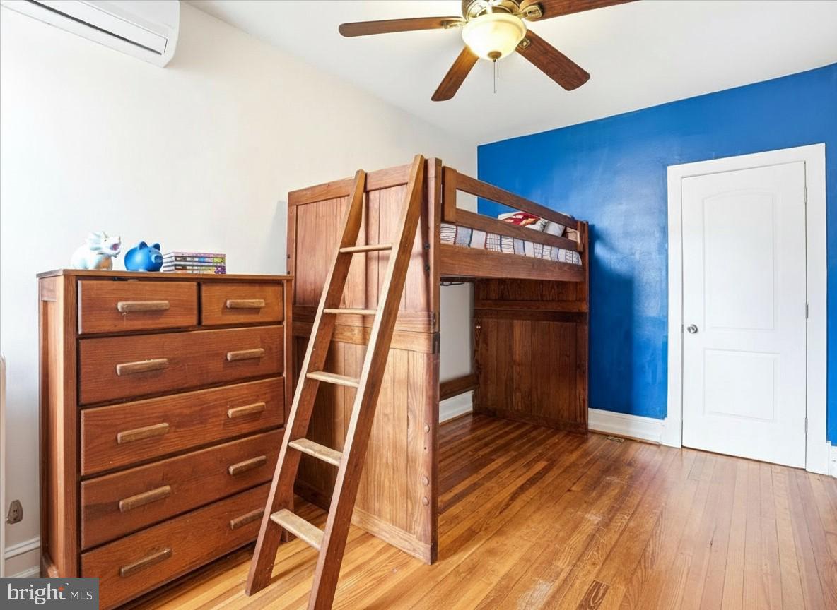 205 East 4th Street Frederick, MD 21701 - Photo 15 of 38 a view of a hallway with wooden floor and staircase