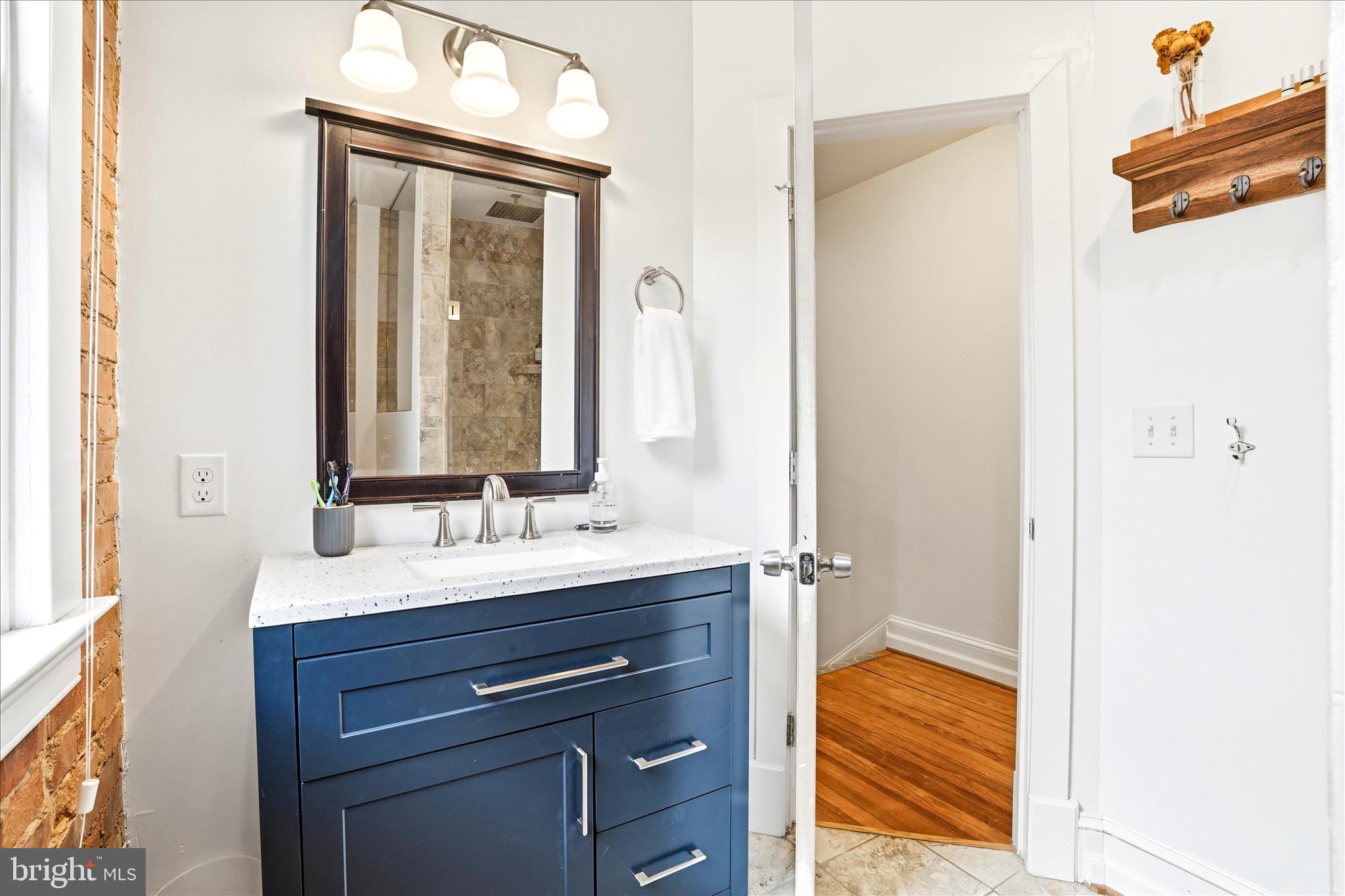 205 East 4th Street Frederick, MD 21701 - Photo 19 of 38 a bathroom with a sink and a mirror
