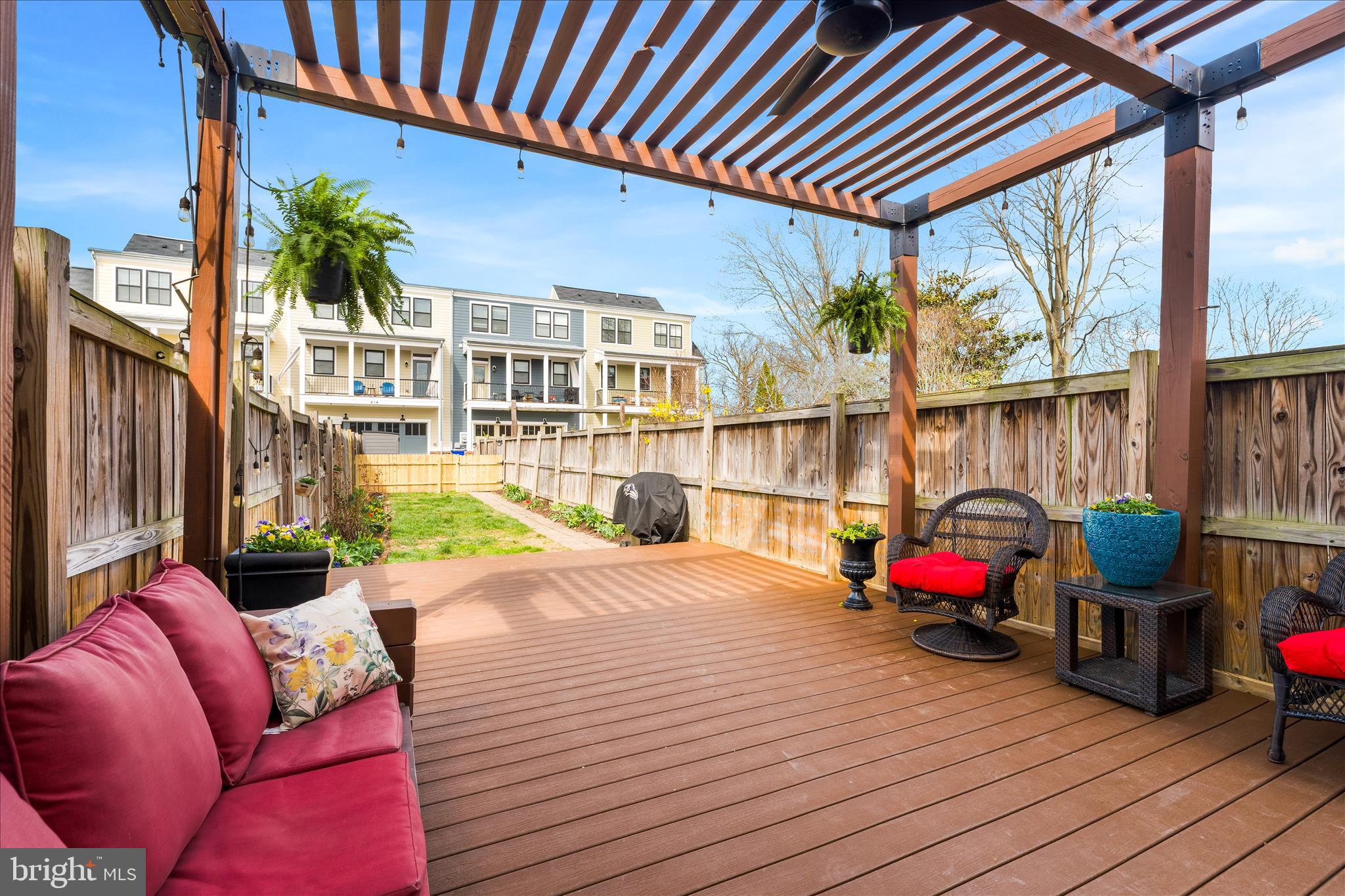 205 East 4th Street Frederick, MD 21701 - Photo 25 of 38 a view of a deck with couches table and chairs with wooden floor