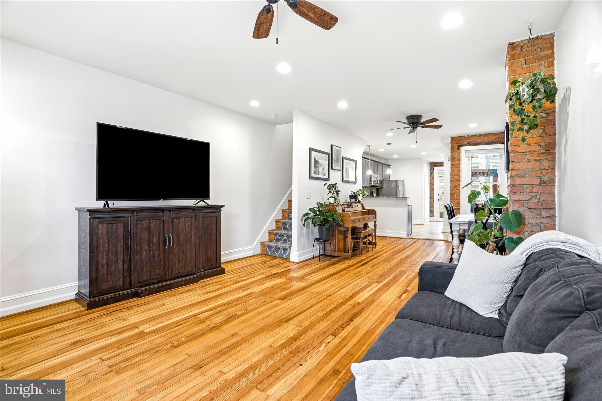 205 East 4th Street Frederick, MD 21701 - Photo 4 of 38 a living room with furniture and a flat screen tv