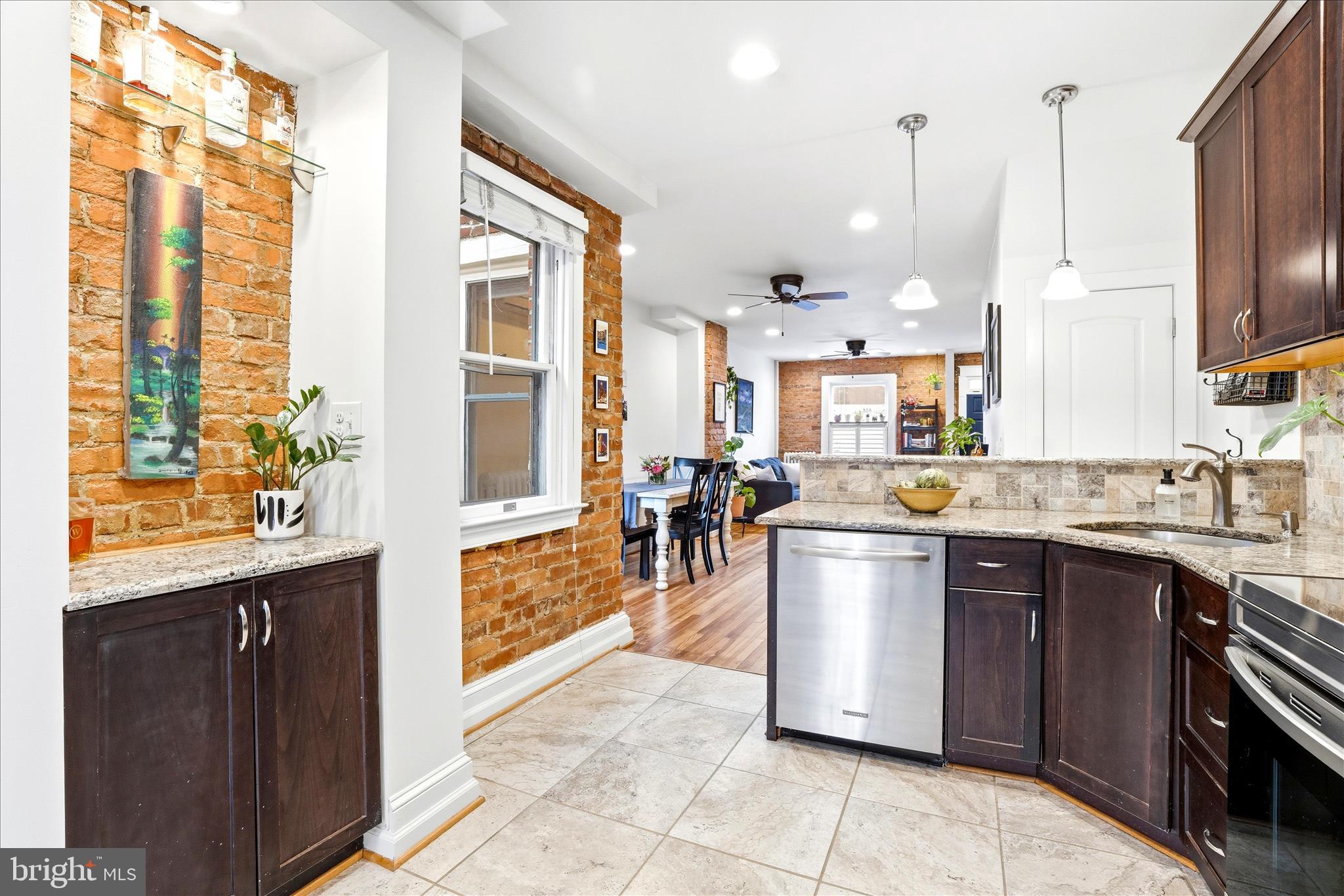 205 East 4th Street Frederick, MD 21701 - Photo 6 of 38 a kitchen with a sink stove and cabinets