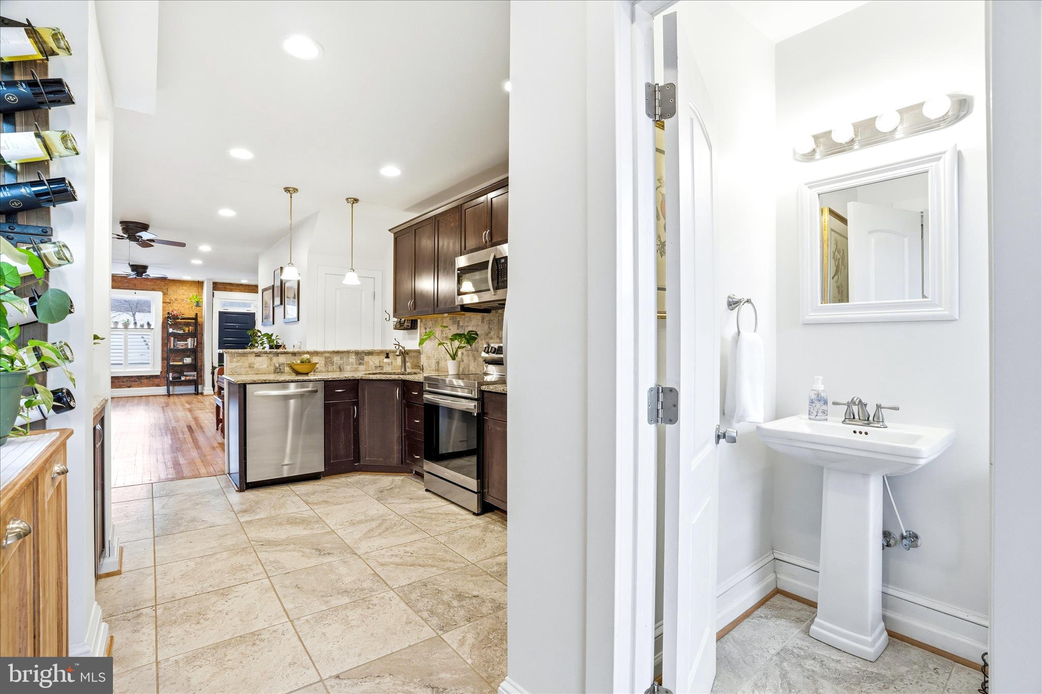 205 East 4th Street Frederick, MD 21701 - Photo 9 of 38 a kitchen with a sink cabinets and appliances