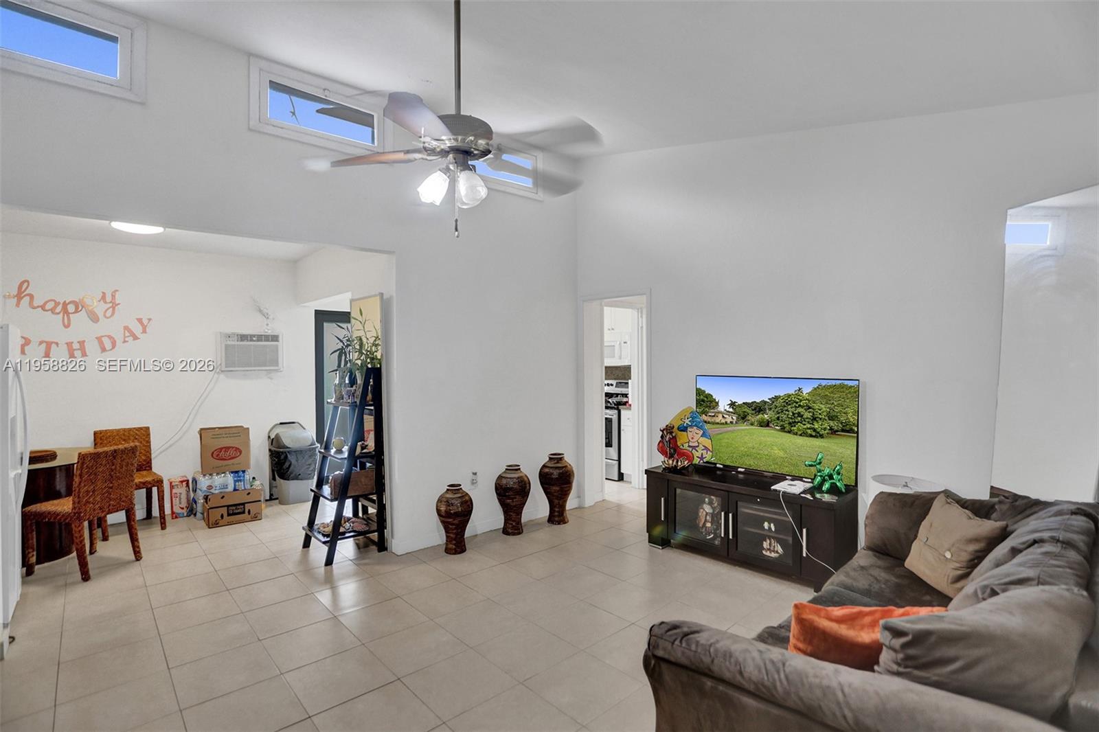3255 Southwest 60th Avenue Miami, FL 33155 - Photo 16 of 42 a living room with furniture and a flat screen tv