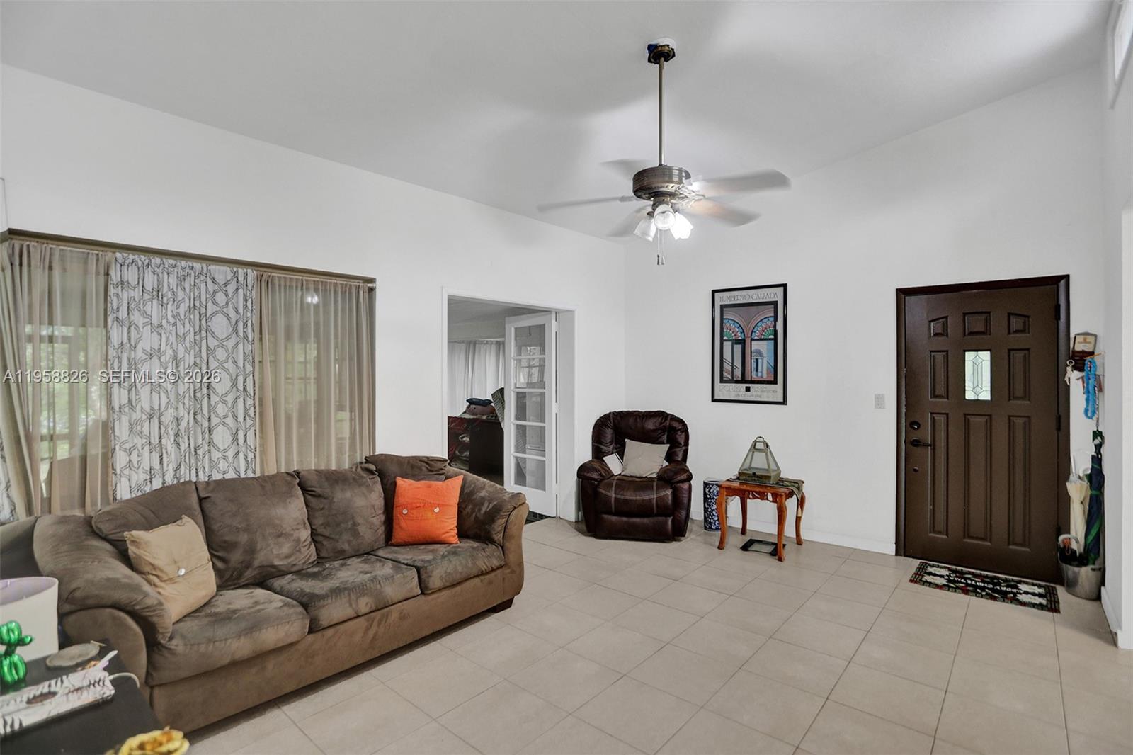 3255 Southwest 60th Avenue Miami, FL 33155 - Photo 18 of 42 a living room with furniture and a ceiling fan
