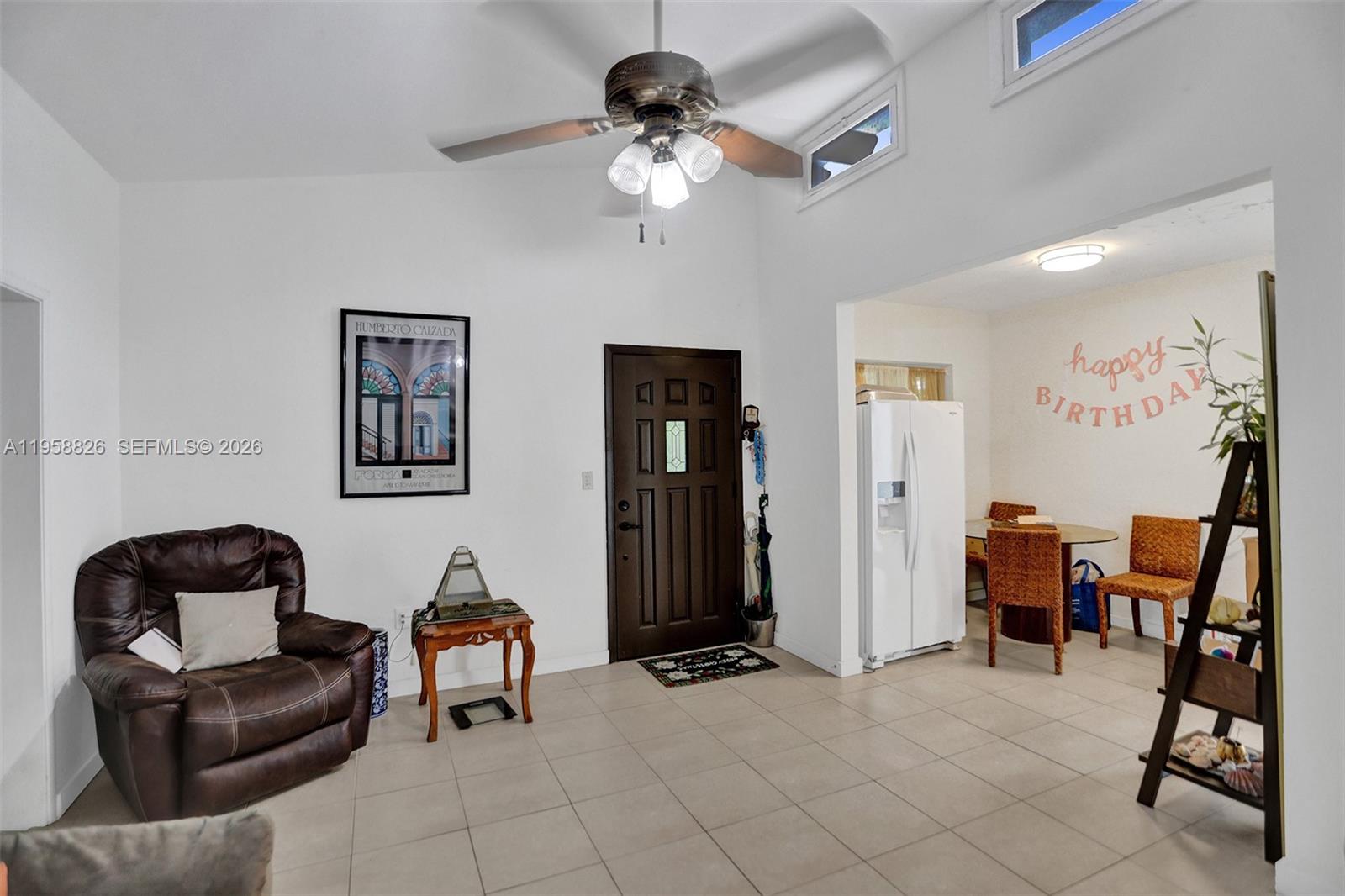 3255 Southwest 60th Avenue Miami, FL 33155 - Photo 19 of 42 a living room with furniture and a piano