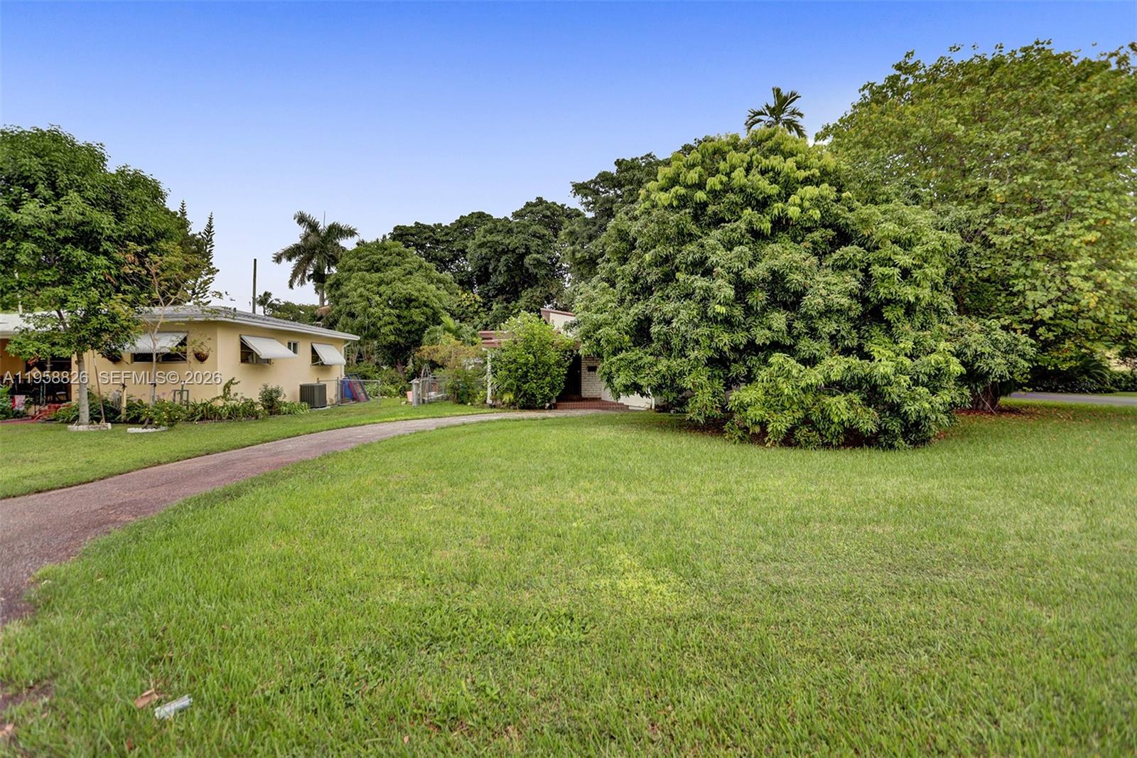 3255 Southwest 60th Avenue Miami, FL 33155 - Photo 2 of 42 a view of a field of grass and trees