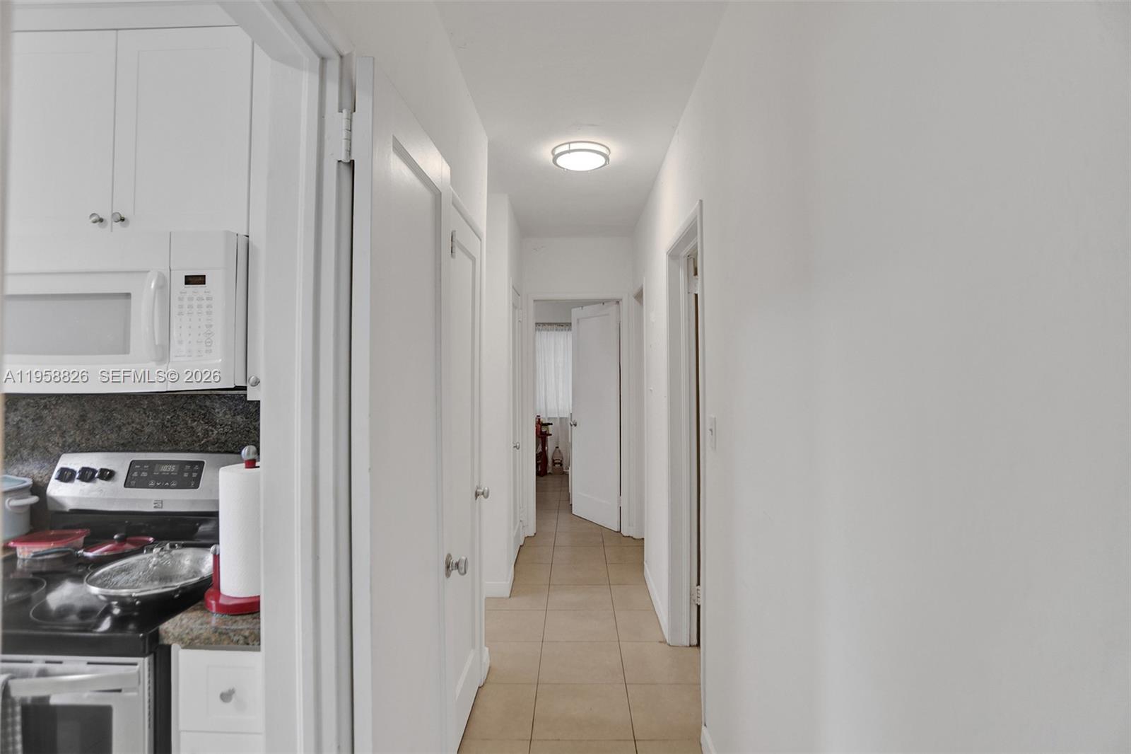 3255 Southwest 60th Avenue Miami, FL 33155 - Photo 27 of 42 a view of a kitchen from the hallway