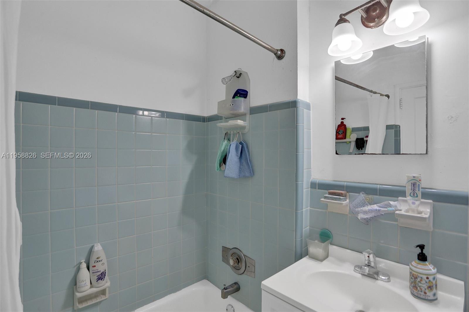 3255 Southwest 60th Avenue Miami, FL 33155 - Photo 30 of 42 a bathroom with a sink vanity mirror and toilet