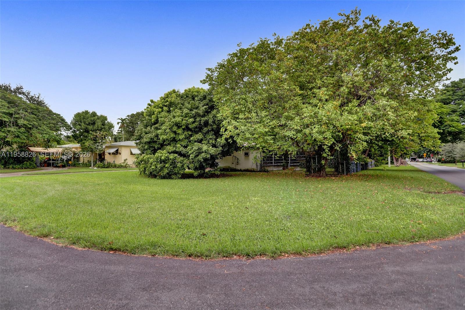 3255 Southwest 60th Avenue Miami, FL 33155 - Photo 3 of 42 a view of a field of grass and trees