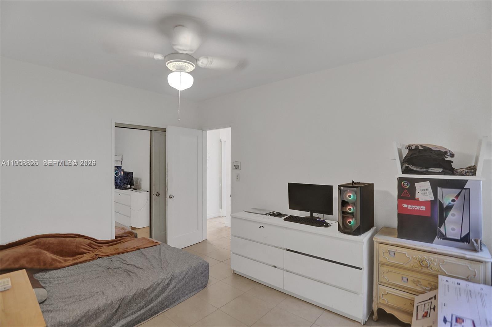 3255 Southwest 60th Avenue Miami, FL 33155 - Photo 32 of 42 a bedroom with a bed and a television