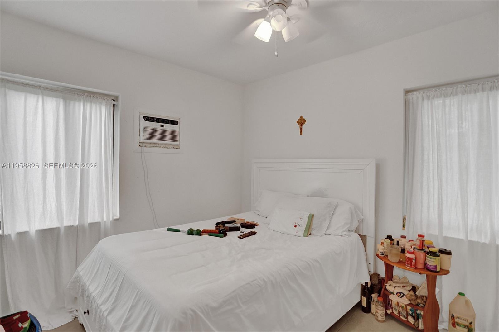 3255 Southwest 60th Avenue Miami, FL 33155 - Photo 33 of 42 a bedroom with a bed and a chandelier