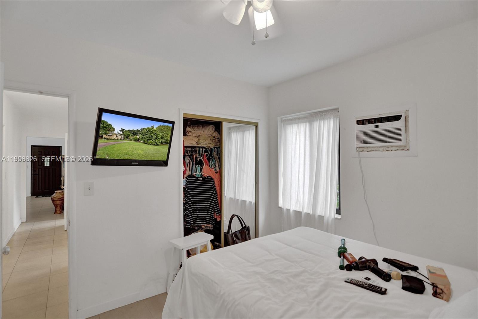 3255 Southwest 60th Avenue Miami, FL 33155 - Photo 34 of 42 a bedroom with a bed and a flat screen tv
