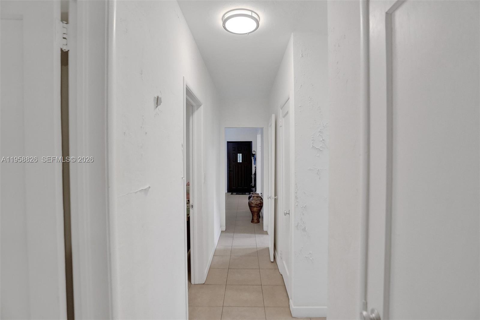 3255 Southwest 60th Avenue Miami, FL 33155 - Photo 35 of 42 a view of a hallway with wooden shelves