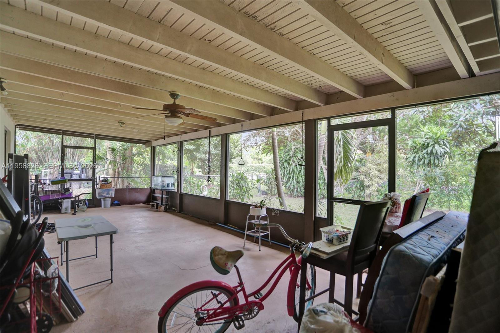 3255 Southwest 60th Avenue Miami, FL 33155 - Photo 36 of 42 a view of a livingroom with furniture and floor to ceiling window