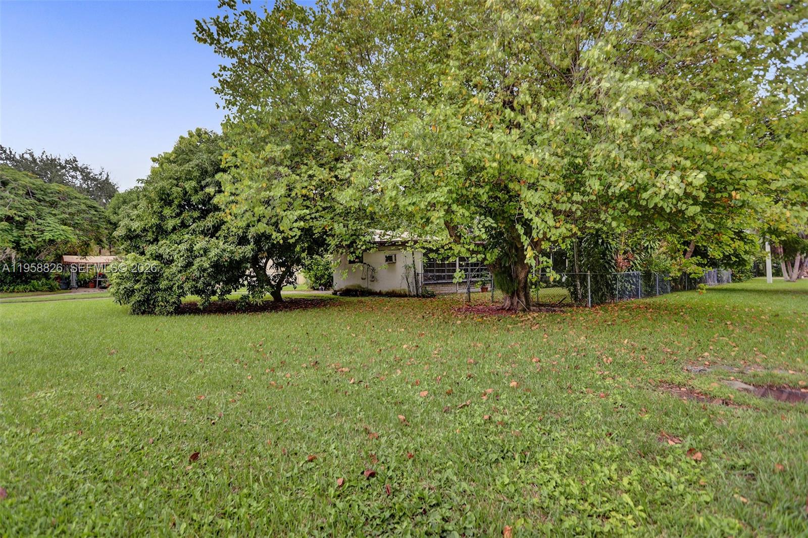 3255 Southwest 60th Avenue Miami, FL 33155 - Photo 4 of 42 a view of a field with trees