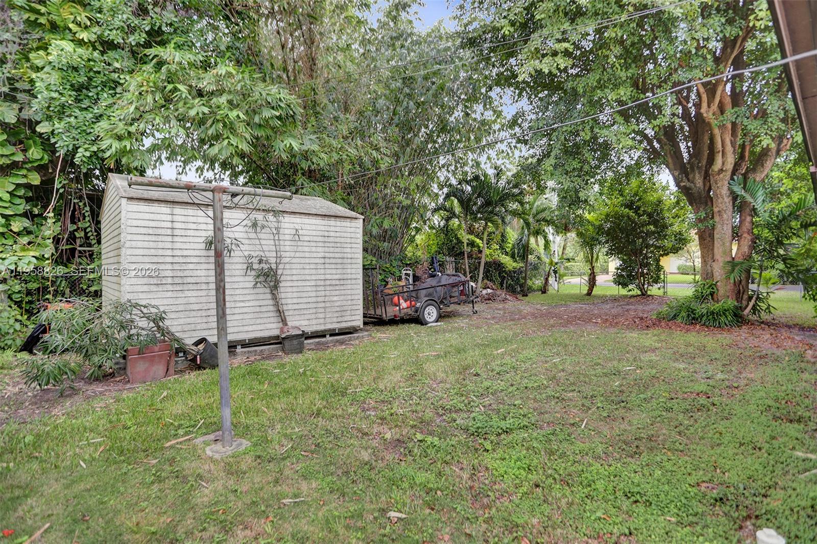 3255 Southwest 60th Avenue Miami, FL 33155 - Photo 41 of 42 a view of a backyard with large trees and plants