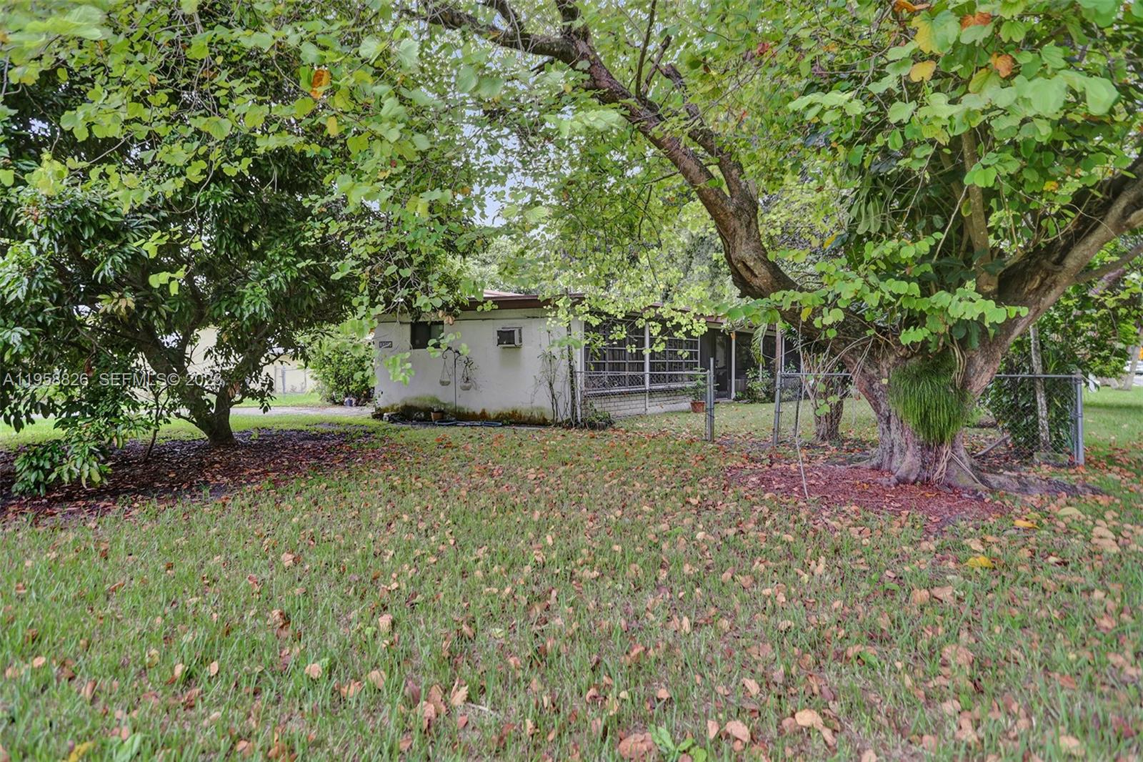 3255 Southwest 60th Avenue Miami, FL 33155 - Photo 7 of 42 a backyard of a house with table and chairs