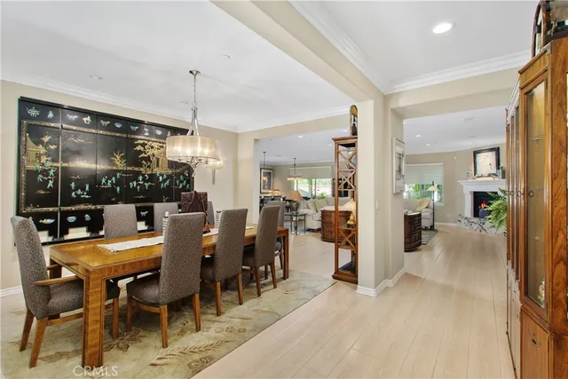 a living room with furniture a fireplace and a ceiling fan
