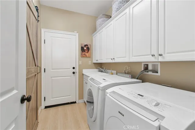 a view of staircase with railing and white walls