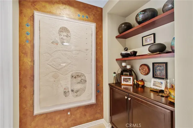 a spacious bedroom with a bed and glass window