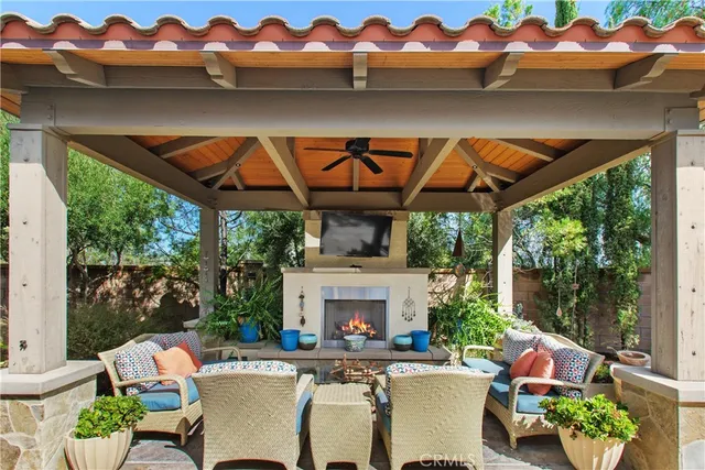 a view of an outdoor sitting area with brick walls