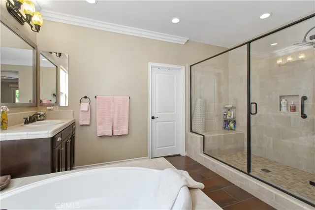 a view of a patio with couches table and chairs and potted plants