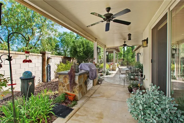 a view of a swimming pool with a patio and a yard