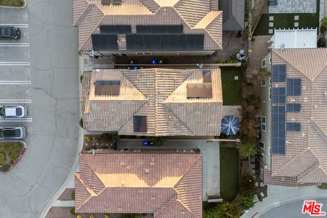 a aerial view of a house with pool