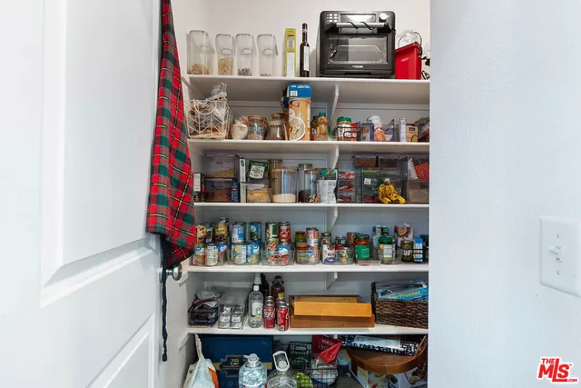 a shelf with books and knick knacks on it