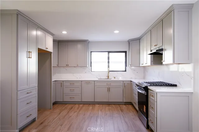 a bedroom with a bed and a wall painting