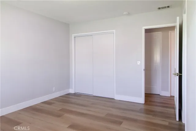 a bathroom with a shower a toilet and a window