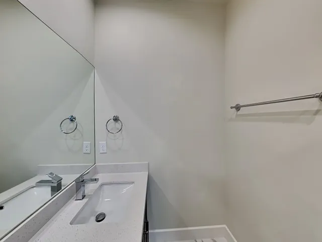 a view of house with backyard and tub