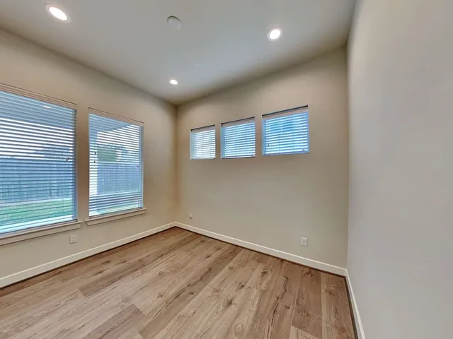 a view of kitchen with stainless steel appliances kitchen island sink refrigerator and microwave