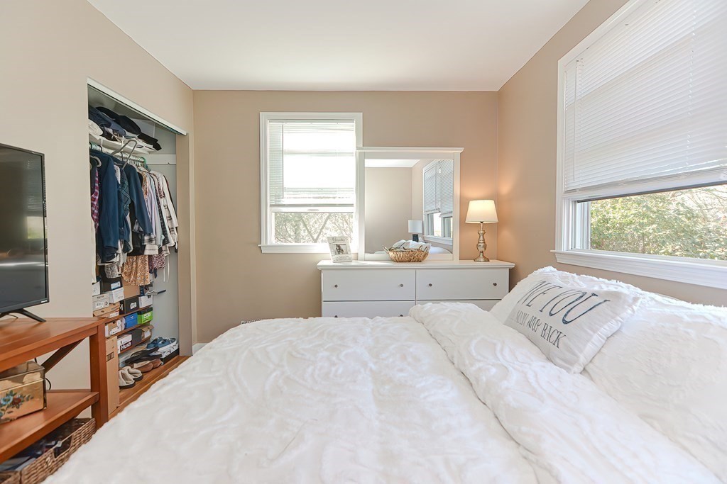 43 Cliff Road Bourne, MA 02532 - Photo 14 of 21 a bedroom with a large bed and a window