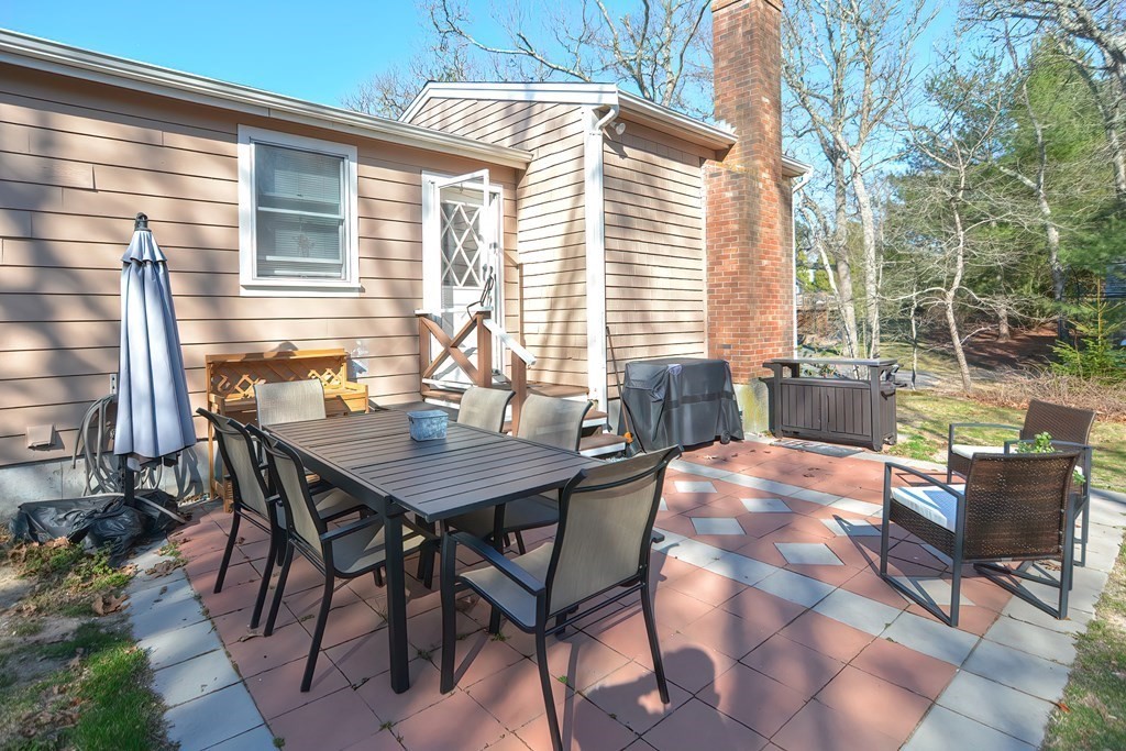 43 Cliff Road Bourne, MA 02532 - Photo 20 of 21 a view of a house with backyard and sitting area