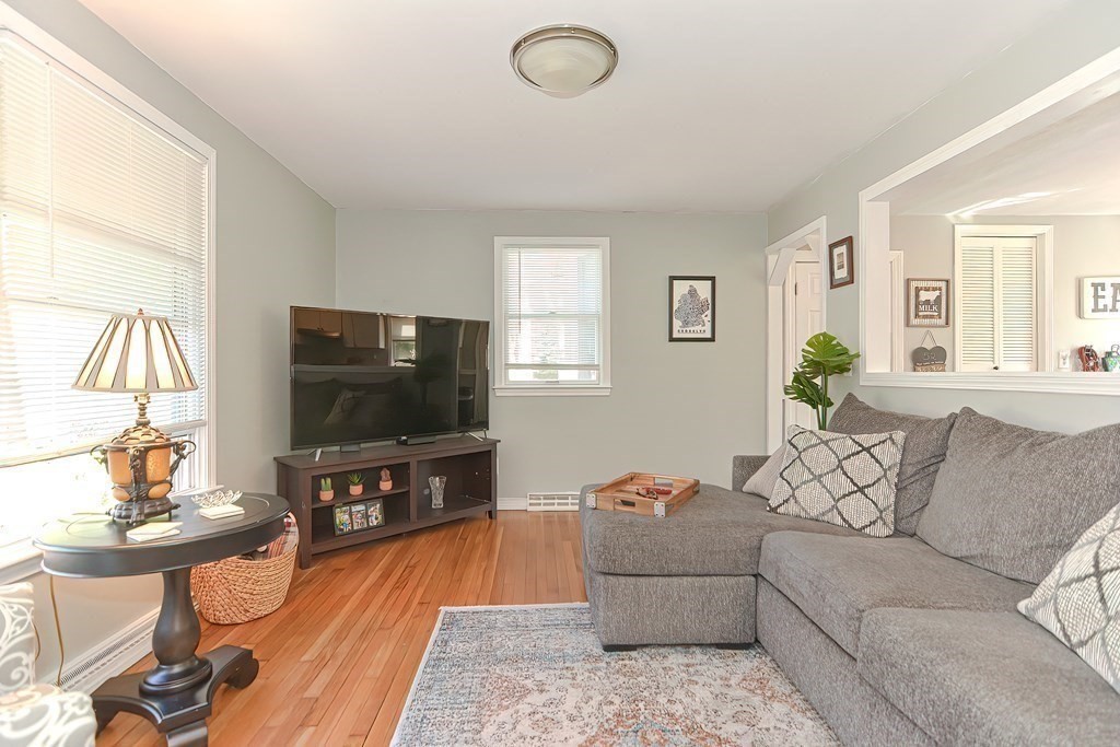 43 Cliff Road Bourne, MA 02532 - Photo 5 of 21 a living room with furniture and a flat screen tv